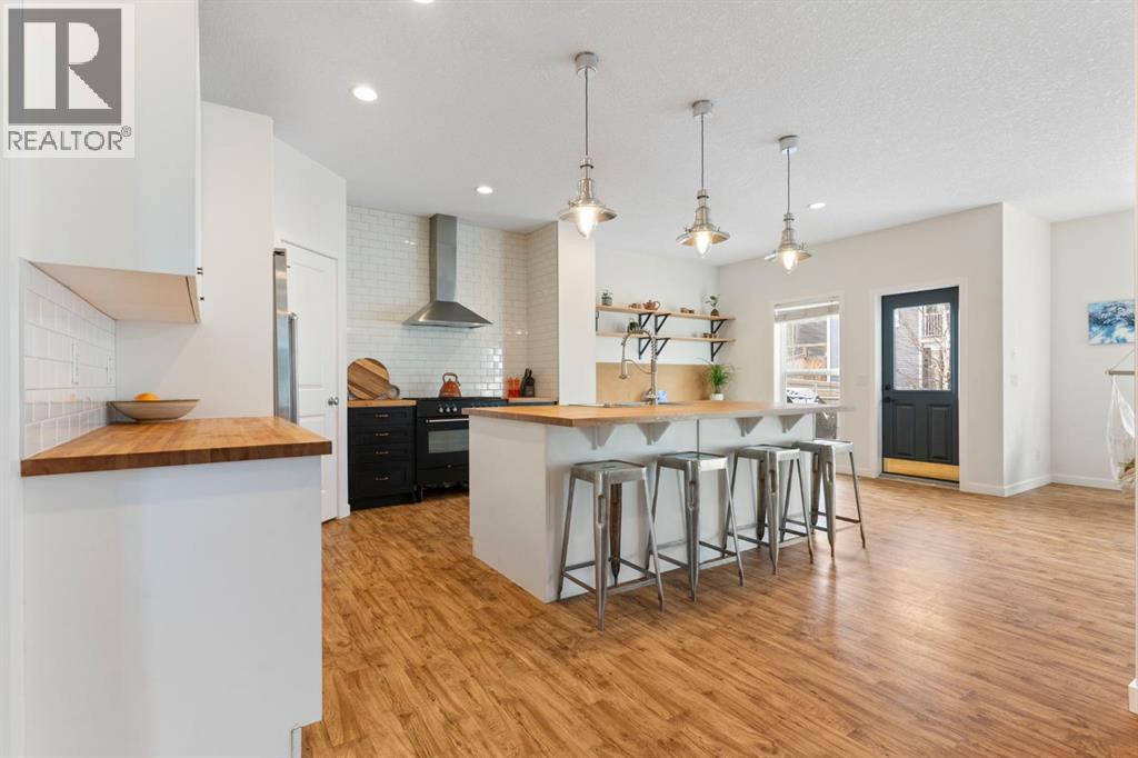 196 Jumping Pound Terrace, Cochrane, AB - Indoor Photo Showing Kitchen With Upgraded Kitchen