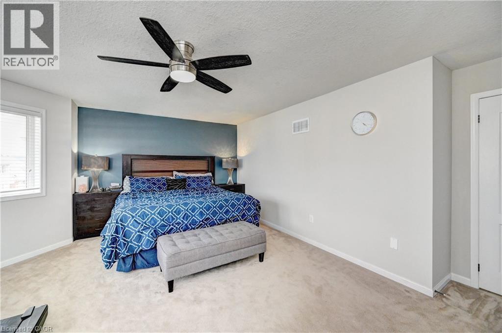 Bedroom with carpet flooring, a textured ceiling, and ceiling fan - 32 Weir Street, Cambridge, ON - Indoor Photo Showing Bedroom