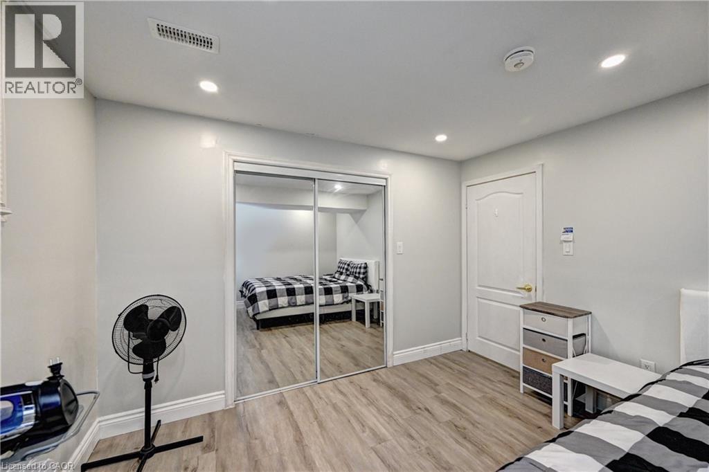 Bedroom featuring light wood-style floors, recessed lighting, and a closet - 32 Weir Street, Cambridge, ON - Indoor