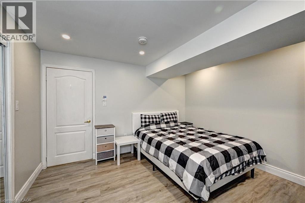 Bedroom with light wood-type flooring and recessed lighting - 32 Weir Street, Cambridge, ON - Indoor Photo Showing Bedroom