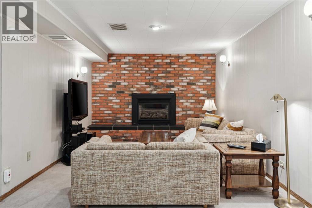 8603 Ashworth Road Se, Calgary, AB - Indoor Photo Showing Living Room With Fireplace