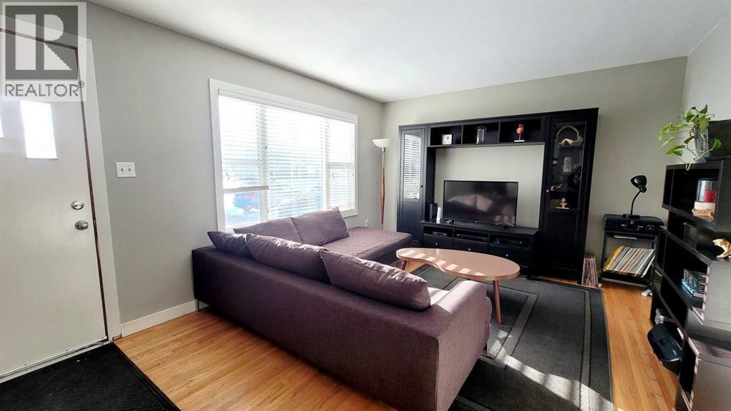 5418 37 Street, Red Deer, AB - Indoor Photo Showing Living Room With Fireplace