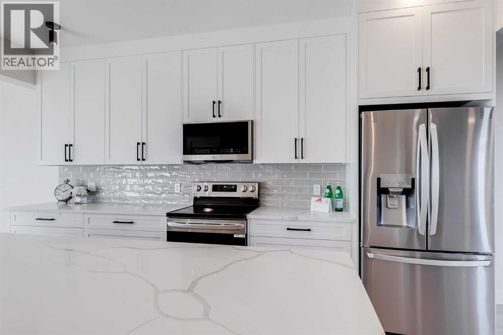 1905 Mccaskill Drive, Crossfield, AB - Indoor Photo Showing Kitchen With Upgraded Kitchen