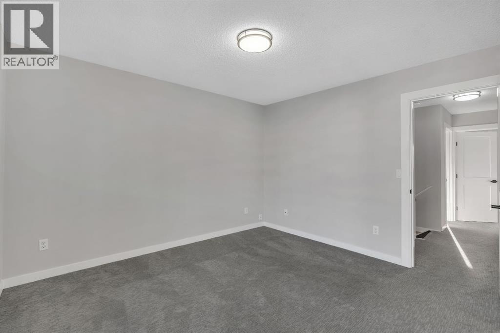 17 Mckernan Road Se, Calgary, AB - Indoor Photo Showing Other Room