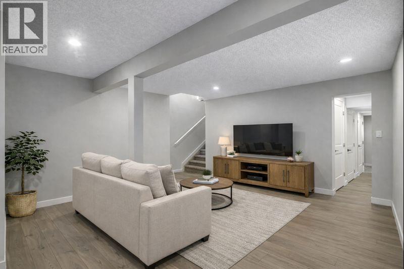 Virtually Staged basment living/flex room - 17 Mckernan Road Se, Calgary, AB - Indoor