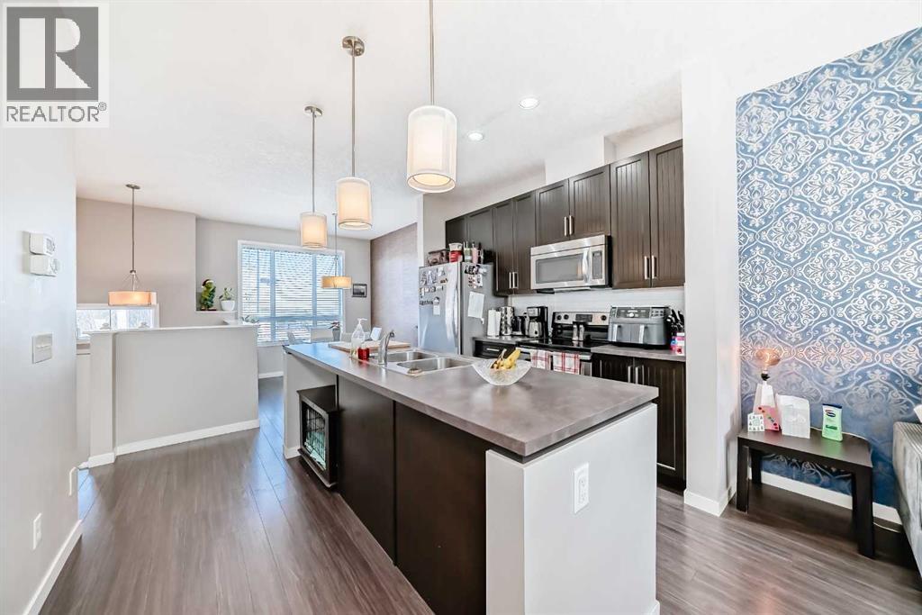 656 Copperpond Boulevard Se, Calgary, AB - Indoor Photo Showing Kitchen With Double Sink With Upgraded Kitchen