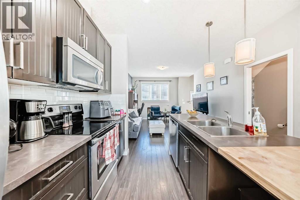 656 Copperpond Boulevard Se, Calgary, AB - Indoor Photo Showing Kitchen With Double Sink With Upgraded Kitchen