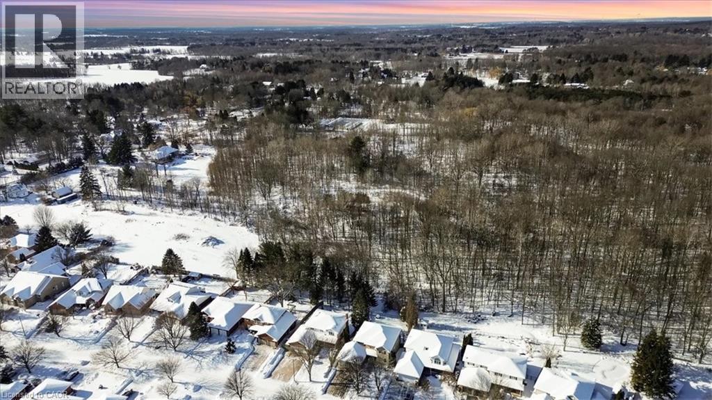 Snowy aerial view with view of scattered trees - 25 Meadowvale Drive Unit# 3, Fonthill, ON - Outdoor With View