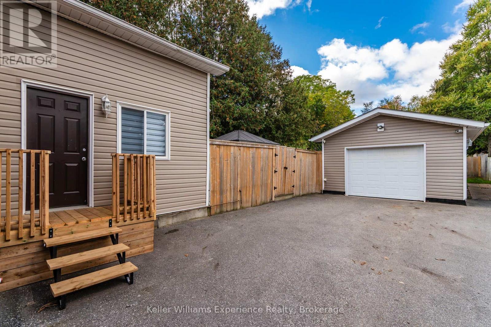 Garage and parking without snow - 196 Fourth Street, Midland, ON - Outdoor With Exterior