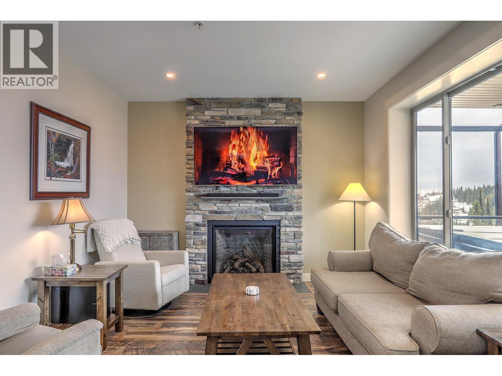 9834 Cathedral Drive, Silver Star, BC - Indoor Photo Showing Living Room With Fireplace