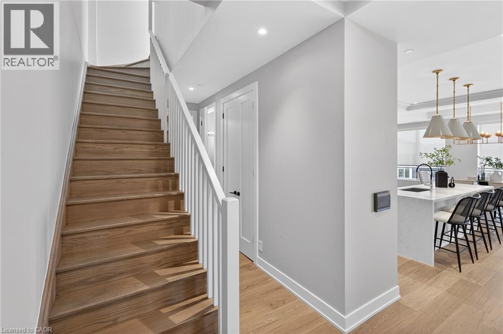 November 2025 - Painted stairs and railing - 123 Maurice Drive Unit# 401, Oakville, ON - Indoor Photo Showing Other Room