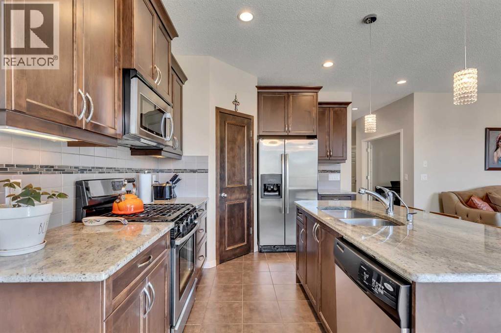 1544 Panatella Boulevard Nw, Calgary, AB - Indoor Photo Showing Kitchen With Double Sink With Upgraded Kitchen