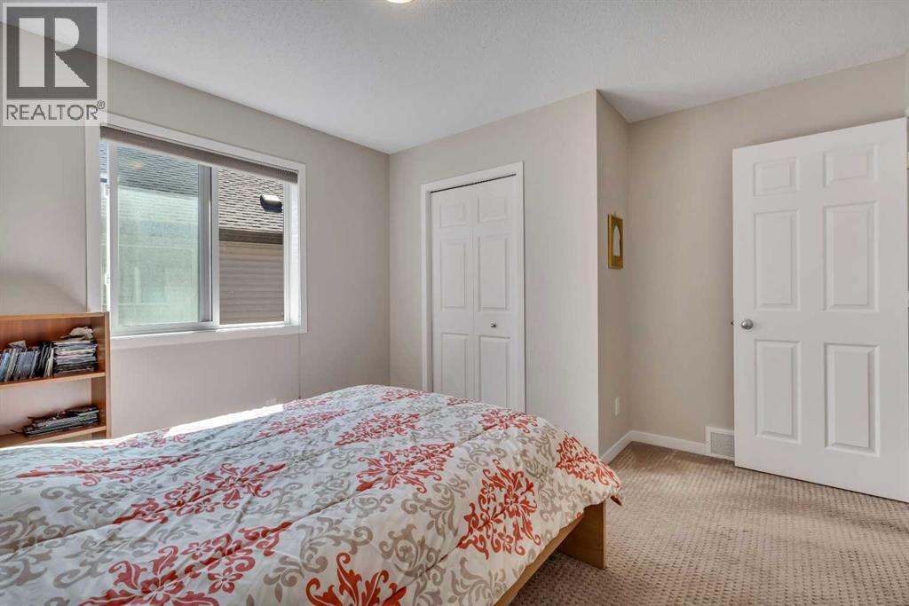 1544 Panatella Boulevard Nw, Calgary, AB - Indoor Photo Showing Bedroom