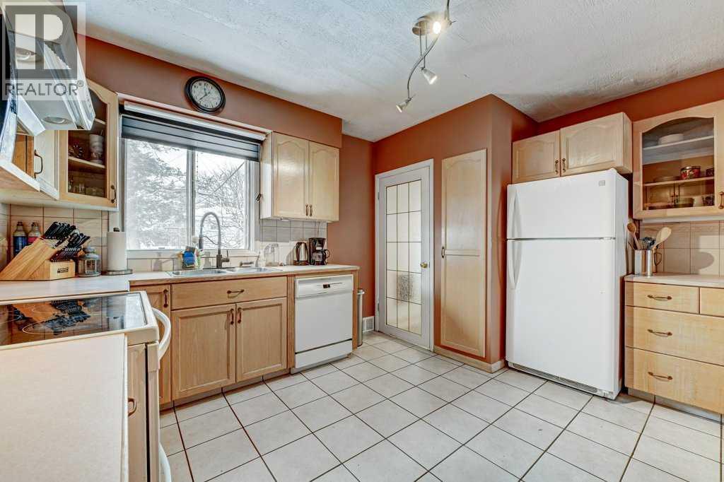 1455 Russell Road Ne, Calgary, AB - Indoor Photo Showing Kitchen With Double Sink