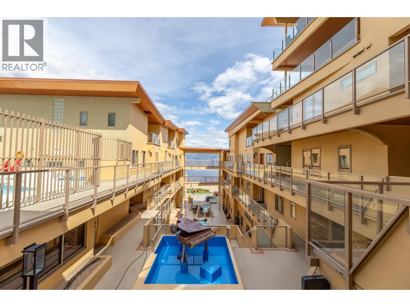 250 Marina Way Unit# 204, Penticton, BC - Outdoor With In Ground Pool With Exterior