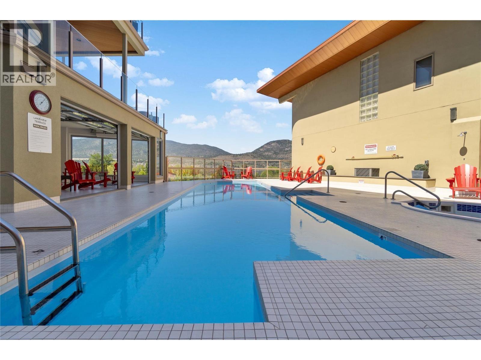 250 Marina Way Unit# 204, Penticton, BC - Outdoor With In Ground Pool With Exterior