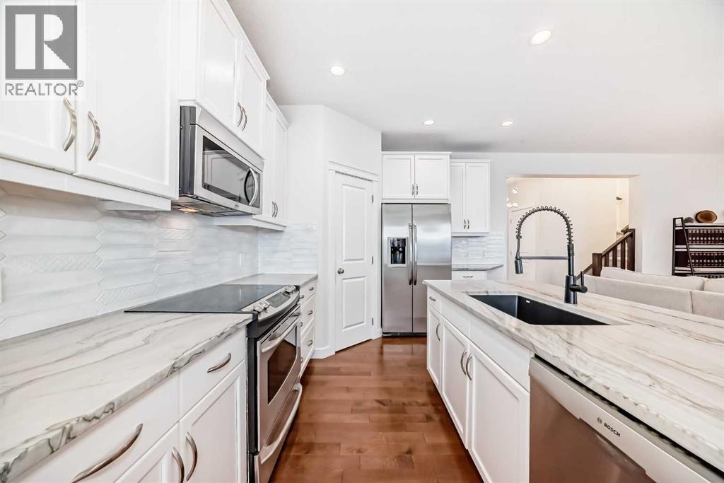 105 Elgin Meadows Circle Se, Calgary, AB - Indoor Photo Showing Kitchen With Upgraded Kitchen