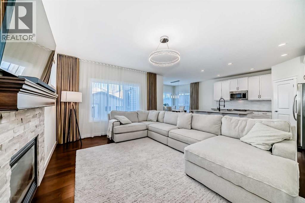 105 Elgin Meadows Circle Se, Calgary, AB - Indoor Photo Showing Living Room With Fireplace