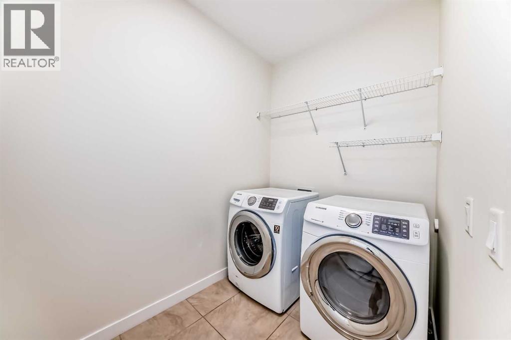 105 Elgin Meadows Circle Se, Calgary, AB - Indoor Photo Showing Laundry Room