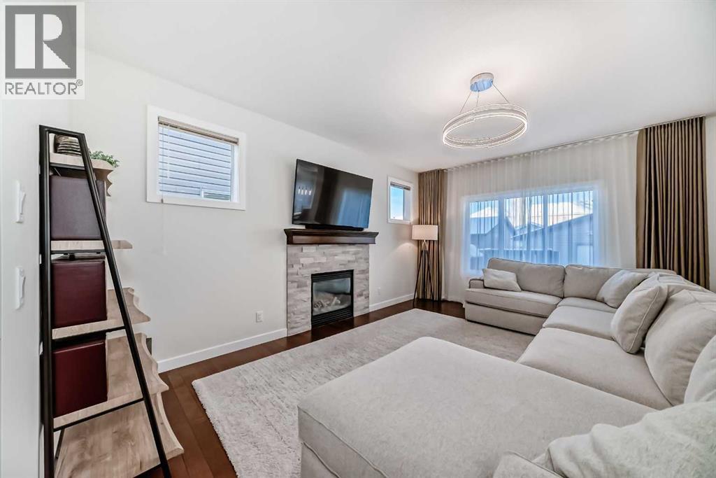 105 Elgin Meadows Circle Se, Calgary, AB - Indoor Photo Showing Living Room With Fireplace