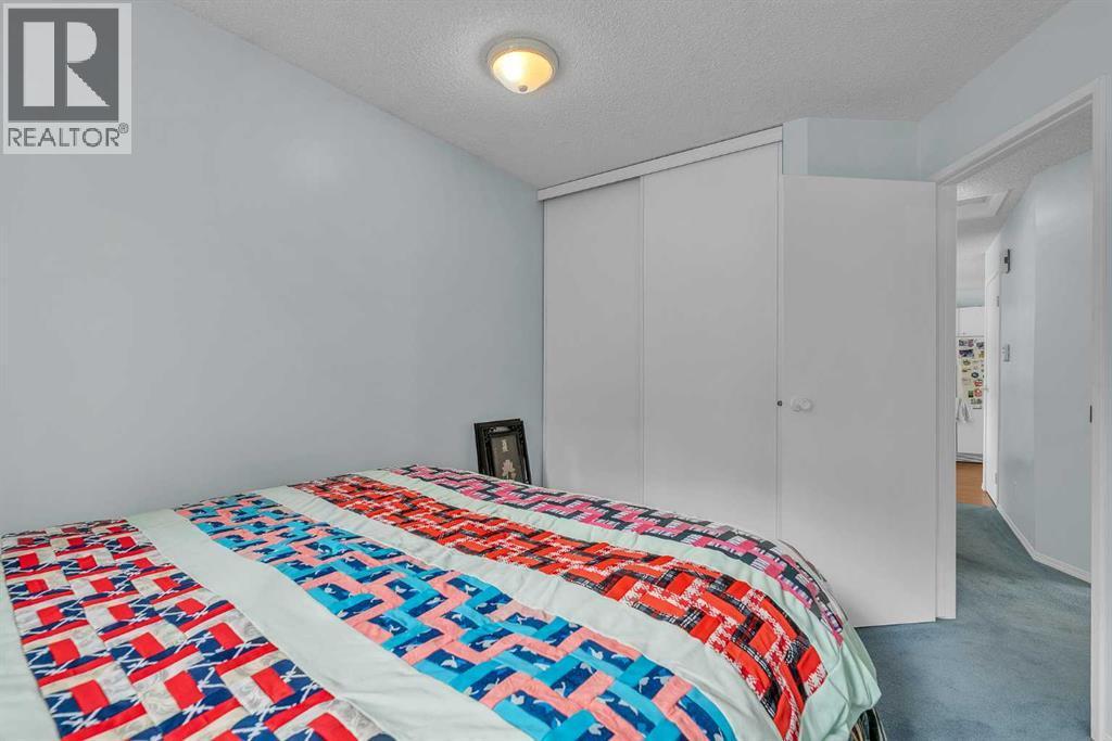 218 Pinemeadow Road Ne, Calgary, AB - Indoor Photo Showing Bedroom