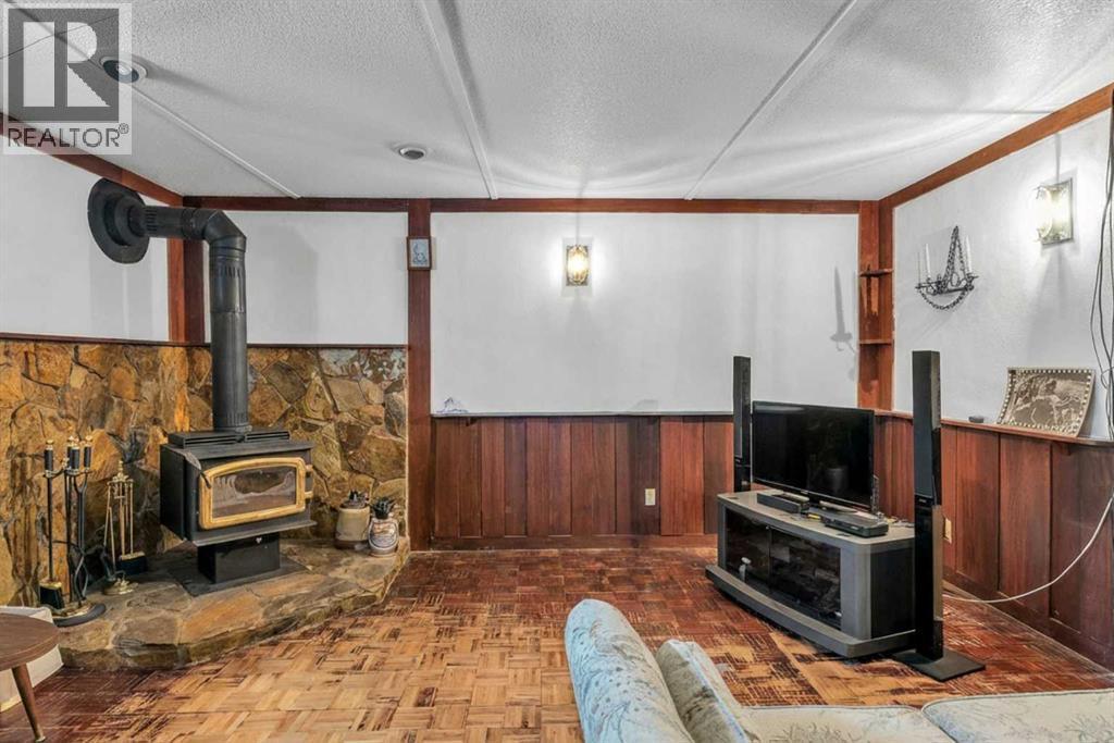 218 Pinemeadow Road Ne, Calgary, AB - Indoor With Fireplace