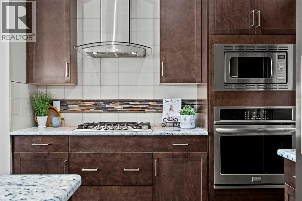 Gas cooktop, built-in oven and microwave - 69 Ravenskirk Close Se, Airdrie, AB - Indoor Photo Showing Kitchen