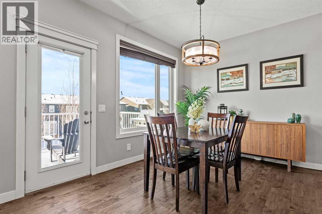 Spacious dining area with deck access - 69 Ravenskirk Close Se, Airdrie, AB - Indoor Photo Showing Dining Room
