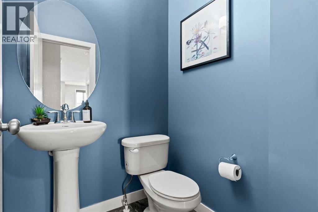 Main floor powder room - 69 Ravenskirk Close Se, Airdrie, AB - Indoor Photo Showing Bathroom