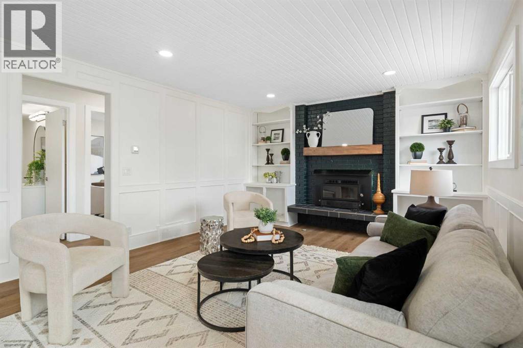 Family Room - 248 Madeira Place Ne, Calgary, AB - Indoor Photo Showing Living Room With Fireplace