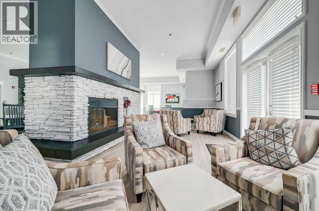 1113, 1113 Lake Fraser Green Se, Calgary, AB - Indoor Photo Showing Living Room With Fireplace