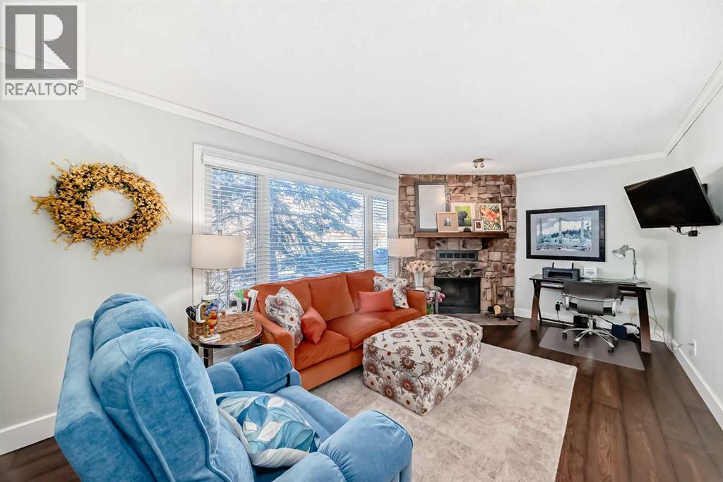 30 Edgewood Rise Nw, Calgary, AB - Indoor Photo Showing Living Room With Fireplace