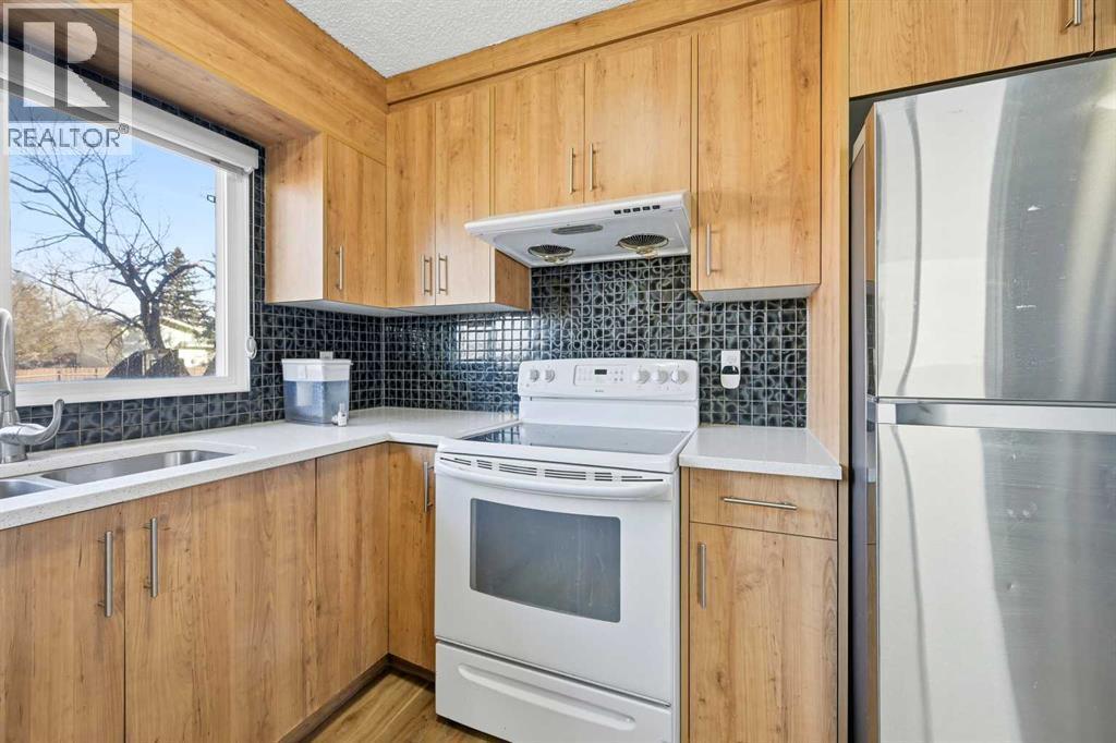 116 Falsby Road Ne, Calgary, AB - Indoor Photo Showing Kitchen With Double Sink
