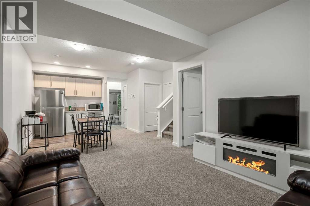223 Savanna Way Ne, Calgary, AB - Indoor Photo Showing Living Room