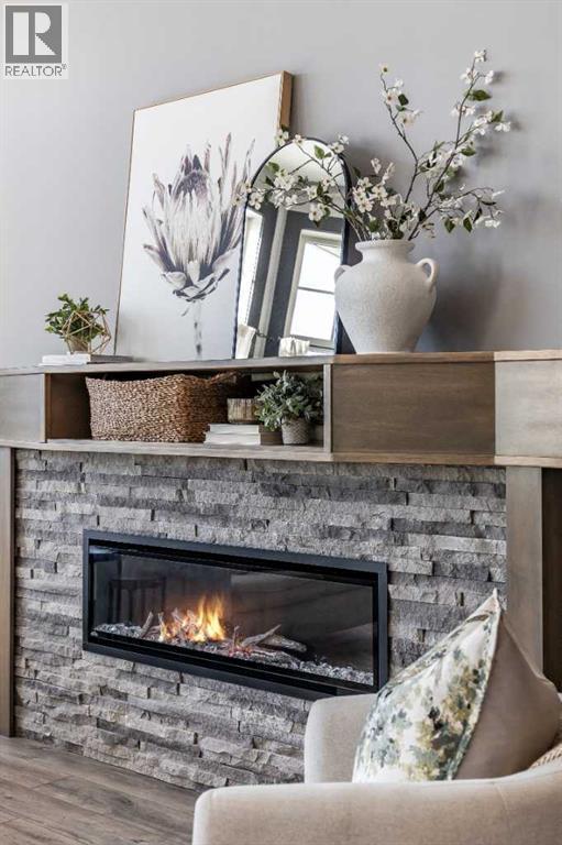 22 Palisades Lane Ne, Medicine Hat, AB - Indoor Photo Showing Living Room With Fireplace