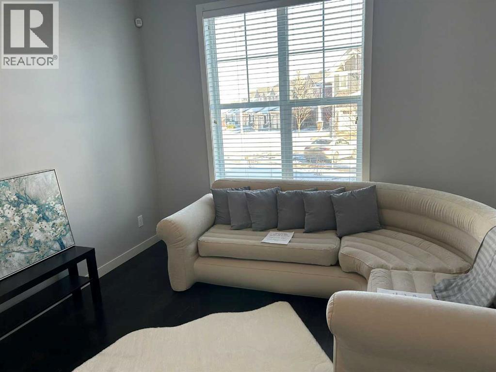 1101, 881 Sage Valley Boulevard Nw, Calgary, AB - Indoor Photo Showing Living Room