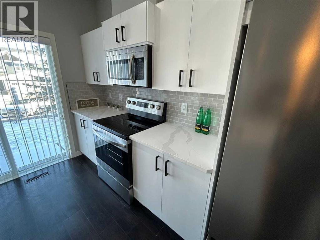 1101, 881 Sage Valley Boulevard Nw, Calgary, AB - Indoor Photo Showing Kitchen With Upgraded Kitchen