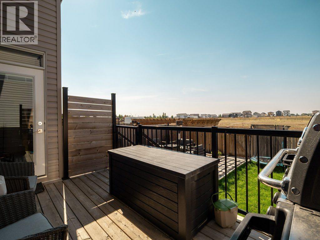 102 Blackwolf Bay N, Lethbridge, AB - Outdoor With Deck Patio Veranda With Exterior