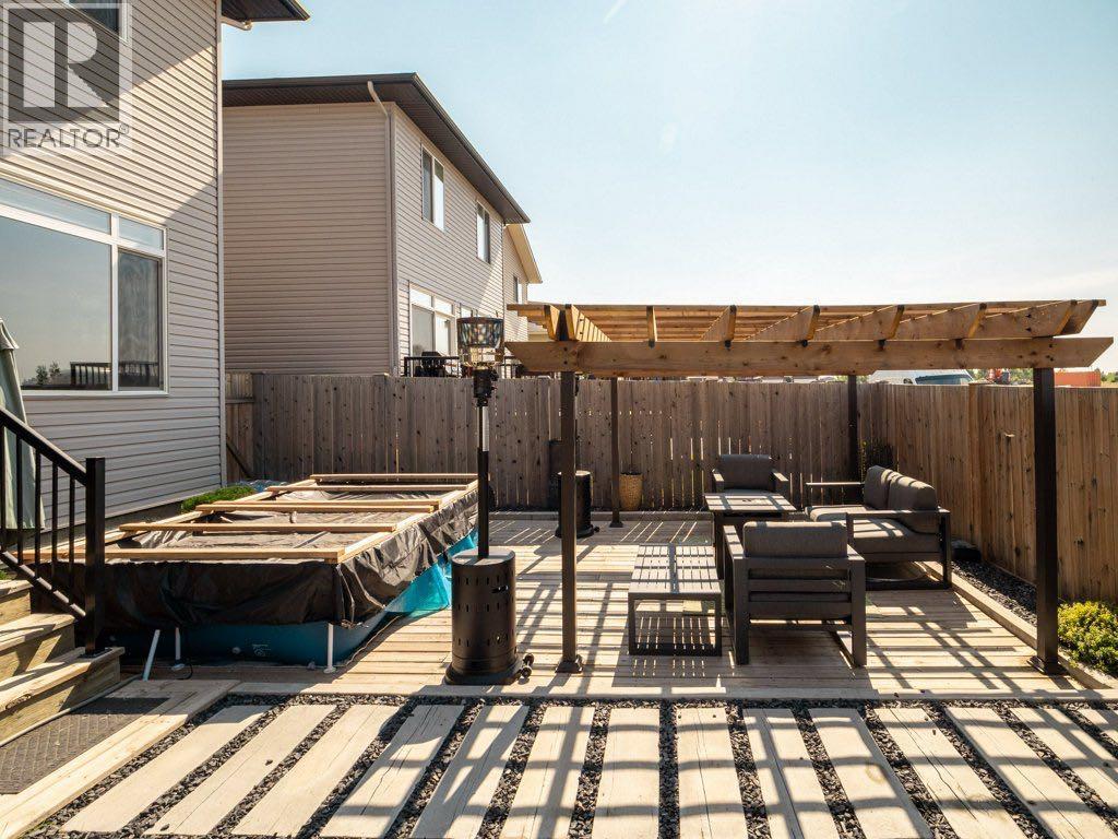 102 Blackwolf Bay N, Lethbridge, AB - Outdoor With Deck Patio Veranda With Exterior
