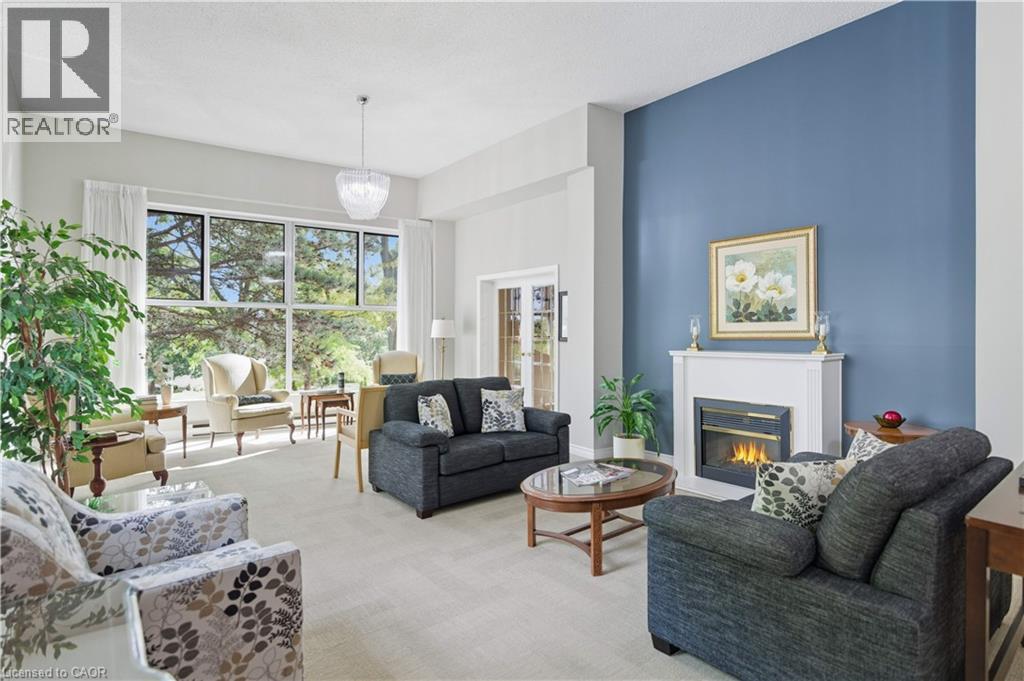 20 Berkley Road Unit# 702, Cambridge, ON - Indoor Photo Showing Living Room With Fireplace