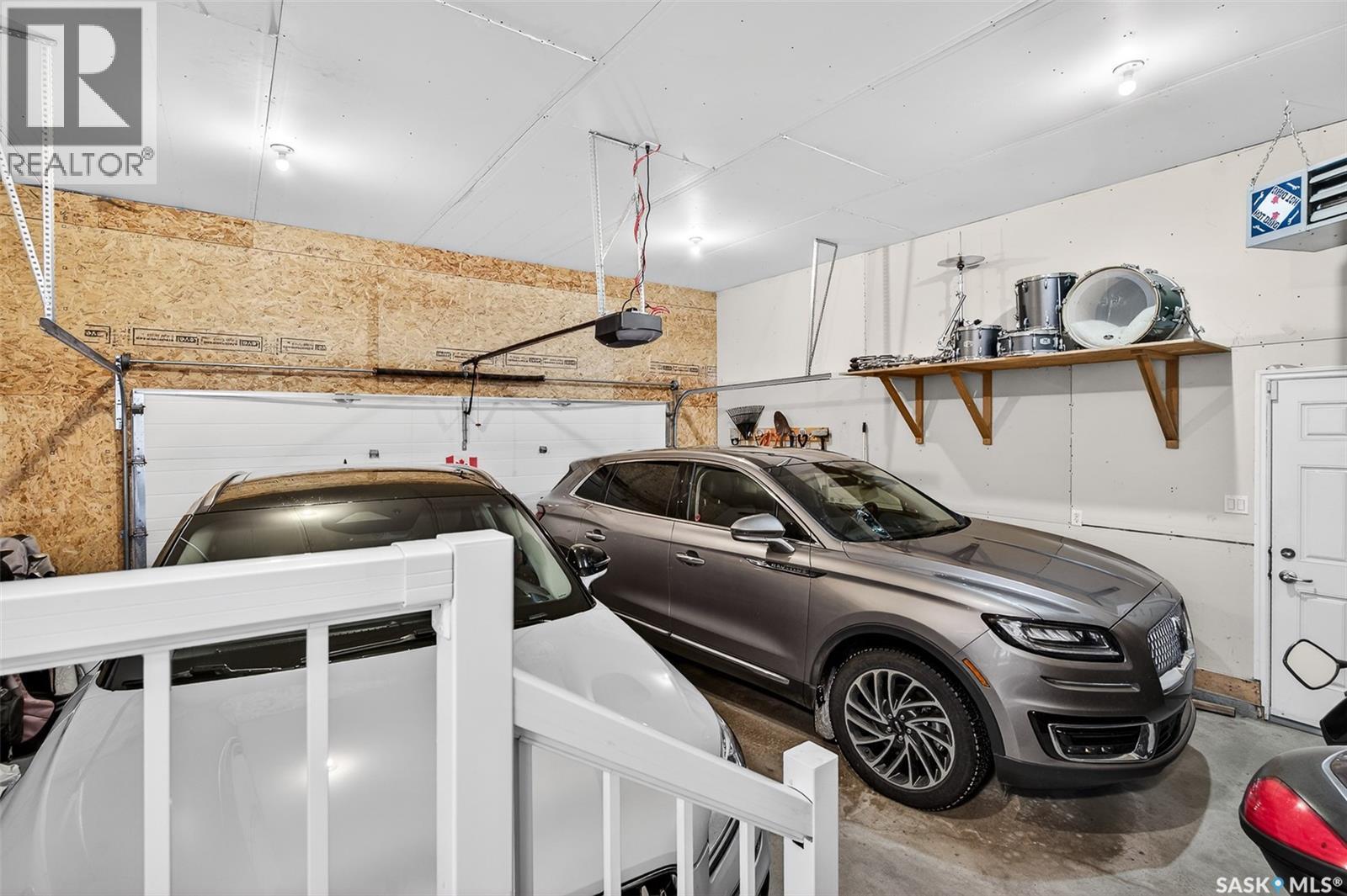 #4 21 Iris Drive, Moose Jaw, SK - Indoor Photo Showing Garage