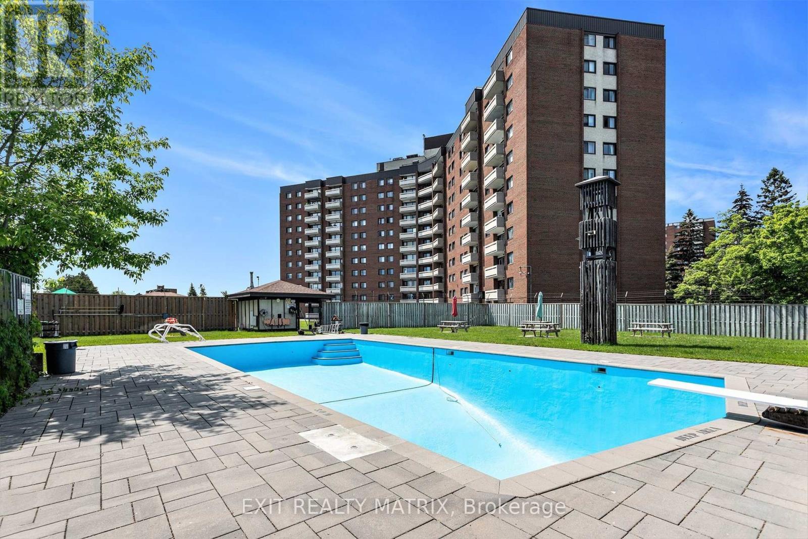 1021 - 3100 Carling Avenue, Ottawa, ON - Outdoor With In Ground Pool