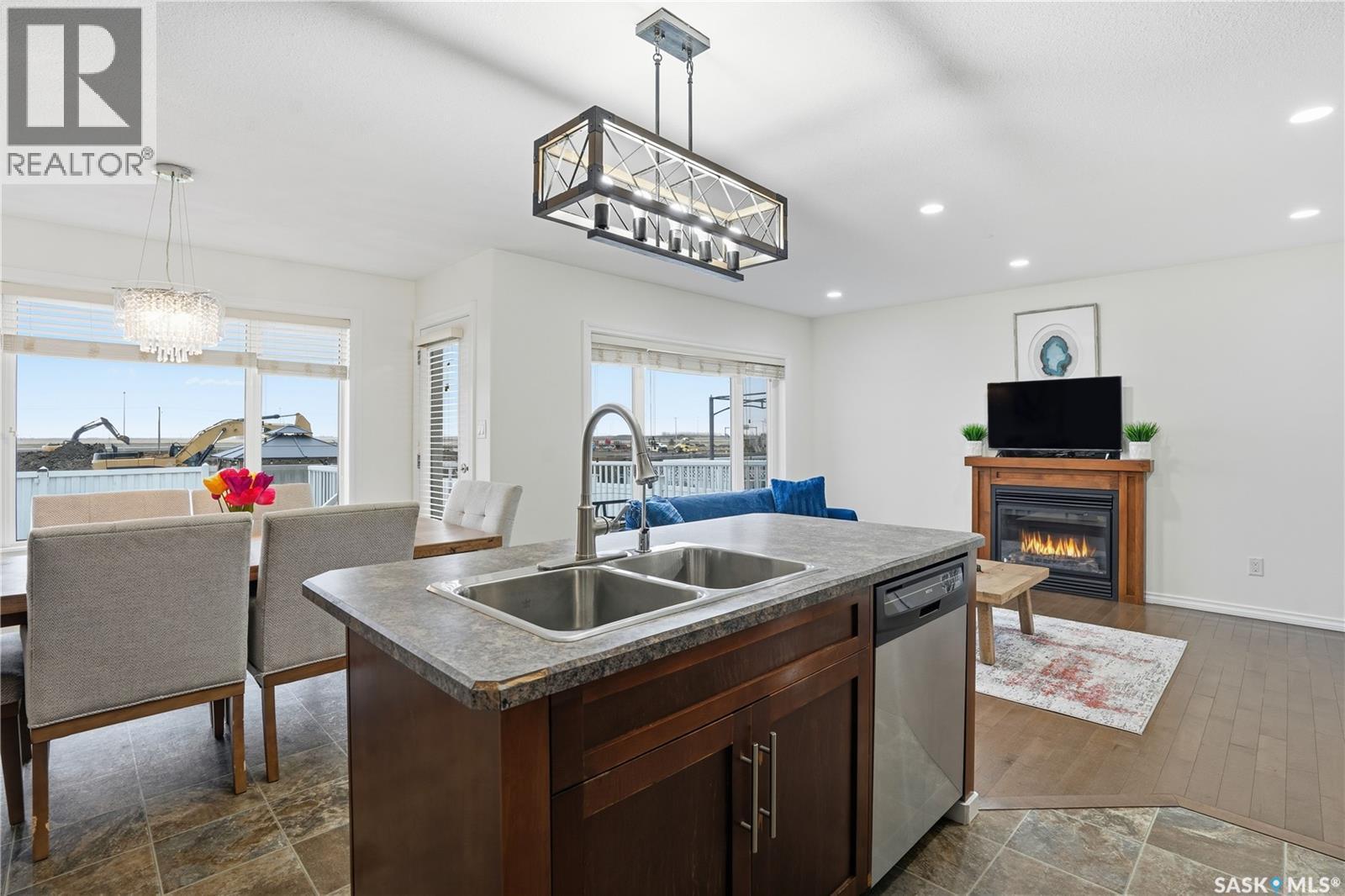 4757 Padwick Avenue, Regina, SK - Indoor Photo Showing Kitchen With Fireplace With Double Sink