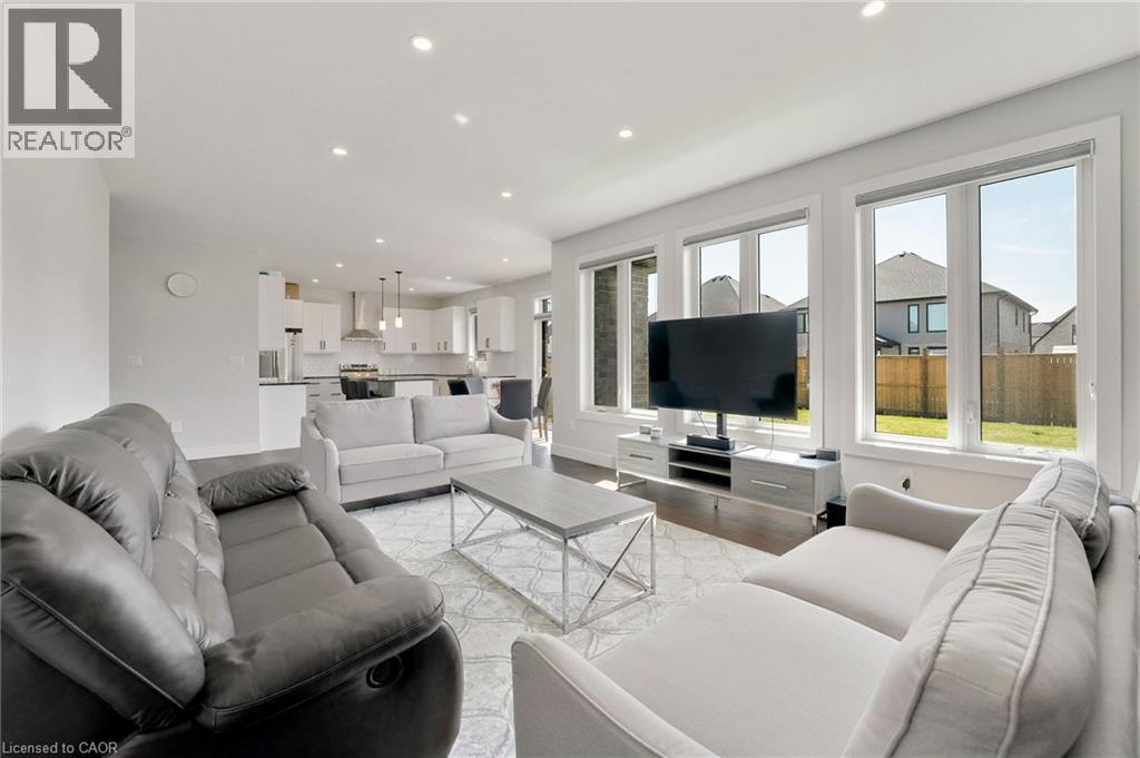 Living room featuring recessed lighting and light wood-style floors - 7266 Silver Creek Circle, London, ON - Indoor Photo Showing Living Room