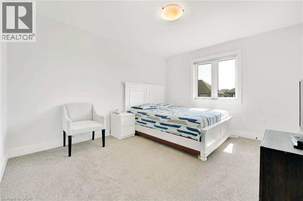 Bedroom with carpet floors - 7266 Silver Creek Circle, London, ON - Indoor Photo Showing Bedroom