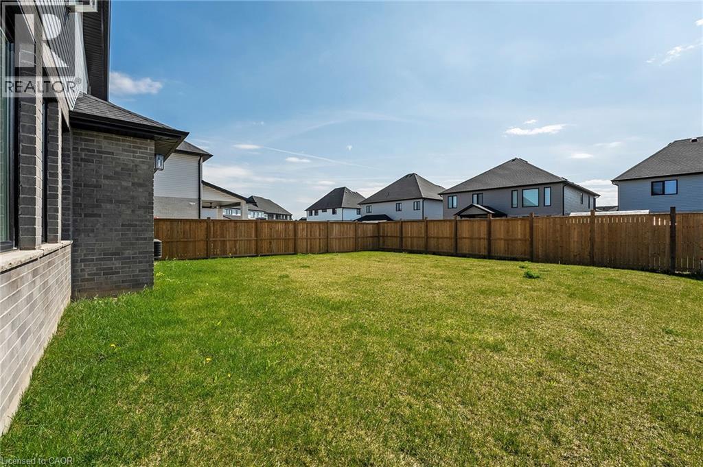 Fenced backyard featuring a residential view - 7266 Silver Creek Circle, London, ON - Outdoor