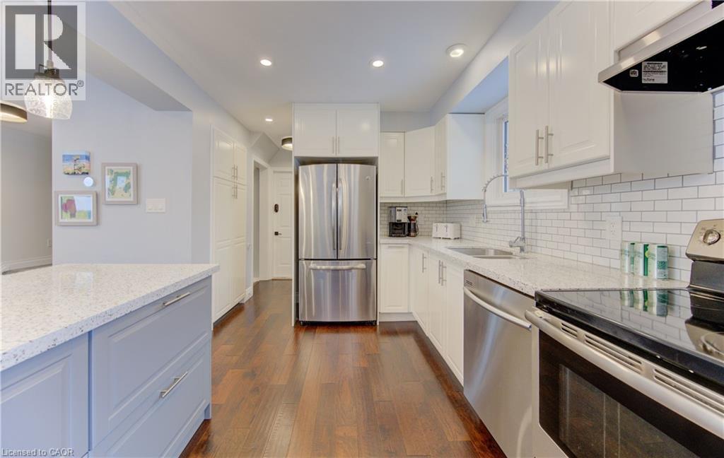Solid surface counters and stainless steel appliances - 51 Nathaniel Crescent, Kitchener, ON - Indoor Photo Showing Kitchen With Stainless Steel Kitchen With Upgraded Kitchen