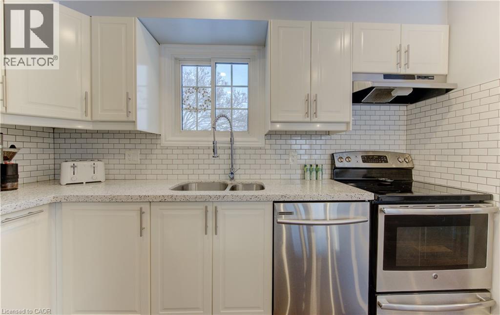 Window at the sink looking to backyard and park - 51 Nathaniel Crescent, Kitchener, ON - Indoor Photo Showing Kitchen With Stainless Steel Kitchen With Double Sink With Upgraded Kitchen