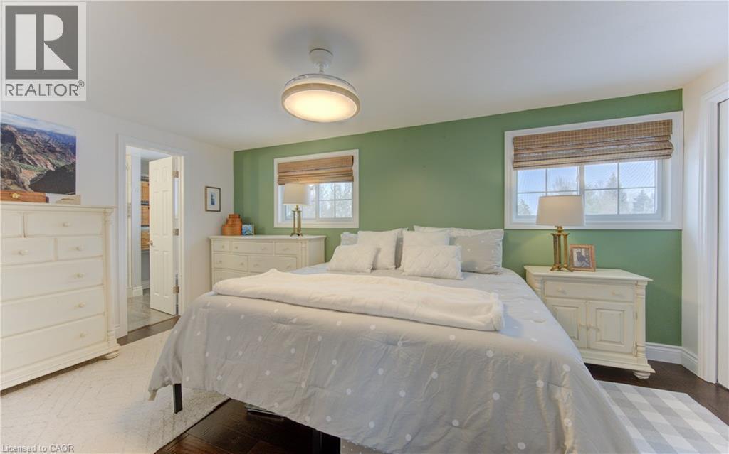 Primary has large windows overlooking backyard and park - 51 Nathaniel Crescent, Kitchener, ON - Indoor Photo Showing Bedroom