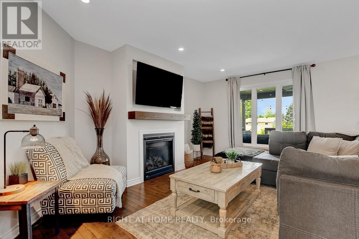 201 Versaille Street, Alfred And Plantagenet, ON - Indoor Photo Showing Living Room With Fireplace